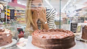 woman excited about chocolate cake